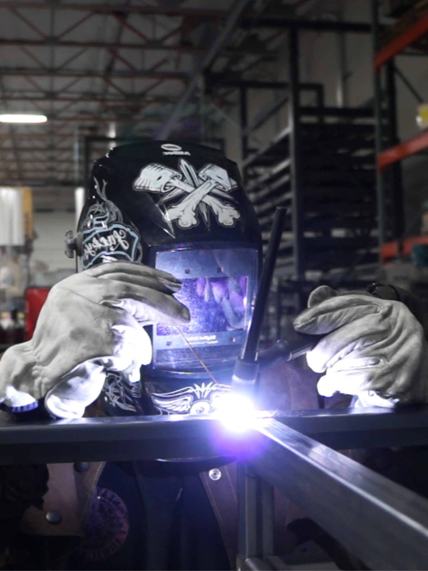 Statement Fabrication — welder at work in a professional metal fabrication workshop
